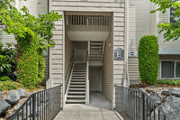 Convenient stairwell access at Building E with well-maintained surroundings.
