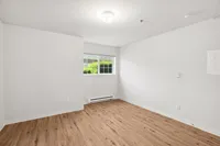 Bright, open bedroom with natural light.