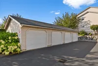 The community offers a clean, well-lit underground parking garage with ample space, concrete support columns, and convenient access for residents’ vehicles, ensuring safety and protection from the elements.