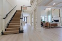 Tradition at Palm Aire grand staircase in furnished clubroom