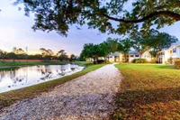 Tradition at Palm Aire Two-Bedroom Apartments In Sarasota, FL - Tradition at Palm Aire - Lake Next To Pathway Leading To Apartments.