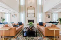 Tradition at Palm Aire furnished clubroom with fireplace in clubroom
