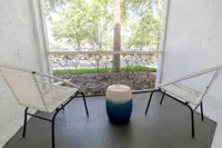 Tradition at Palm Aire exterior patio of apartment building on sunny day