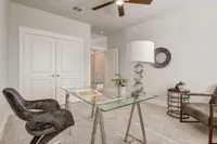 Furnished office with glass desk and office chair