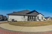 Exterior view of the back of a home and yard