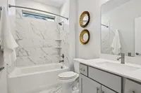 Bathroom with tiled shower bath combination