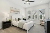 main bedroom with oversized windows