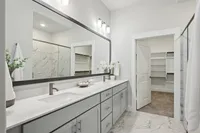 main bathroom with dual vanity