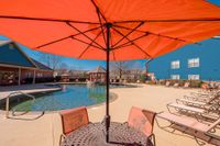 The Grand Reserve at Madison Sparkling swimming pool with chairs and umbrellas