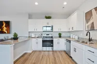 Sanctuary at Indian Creek Furnished kitchen with white cabinetry
