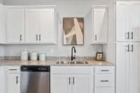 Sanctuary at Indian Creek Furnished kitchen with white cabinetry