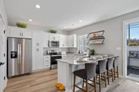 Sanctuary at Indian Creek Furnished kitchen with white cabinetry