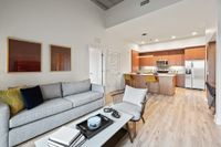 Luna at Viera Stylish living room looking into modern kitchen with breakfast bar