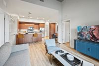 Luna at Viera Stylish living room looking into modern kitchen with breakfast bar