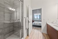 Luna at Viera 1-Bedroom Luxury Apartments Viera FL - Luna At Viera - Upscale Bathroom Featuring A Spacious Shower With A Glass Shower Door And Accent Tile