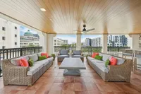 Outdoor lounging area with couches and tables