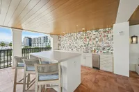 Outdoor kitchen area with large island