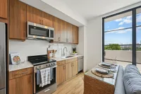 Studio kitchen with wood cabinets