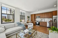 Living room and kitchen with small dining area