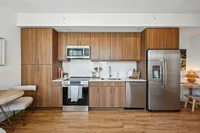 Kitchen with wood cabinets and stainless steel appliances