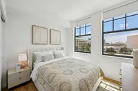 Bedroom with bed and dresser