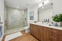 Bathroom with walk in shower and large vanity