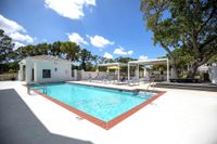 Tradition at Palm Aire Pool with lounge chairs