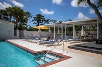Tradition at Palm Aire Pool with lounge chairs
