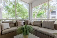 Tradition at Palm Aire Screened in porch with L shaped couch