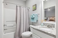 Bathroom with shower/tub combo and single vanity