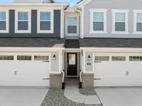 Front of townhomes with attached two car garages