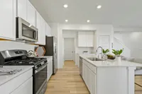3-Bedroom Townhomes in Westfield, IN - Casey Corner Townhomes - Kitchen With Stainless Appliances With Gas Range, and Kitchen Island.