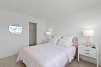 Furnished guest bedroom with closet