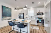 kitchen with stainless steel appliances and prep island