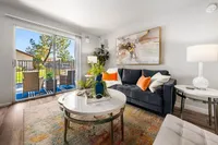 decorated living area sliding glass doors to back patio