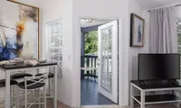 view of private patio/balcony with living room and dining table