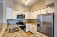 Renovated kitchen with white cabinets
