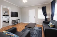 Living room looking into primary bedroom