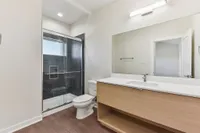 Bathroom with walk-in shower and large vanity
