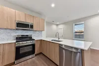 Kitchen with light wood cabinets