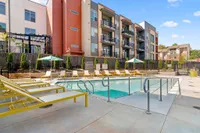 community pool with lounge chairs