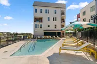 community pool with lounge chairs