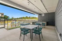 poolside kitchen with dining tables