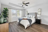 main bedroom with wood style flooring