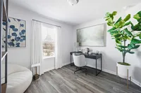 home office with wood style flooring