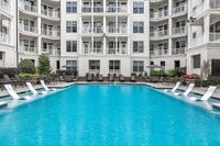Swimming pool with sundeck and lounge chairs