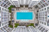 Drone of the swimming pool with sundeck and lounge chairs