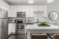 Kitchens at The Jane with white cabinets and large island