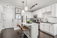 Kitchens at The Jane with white cabinets and large island