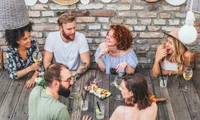 group of people eating at restaurant
